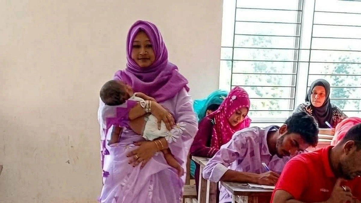 কক্ষ পরিদর্শকের কোলে শিশু, নির্বিঘ্নে পরীক্ষা দিলেন মা