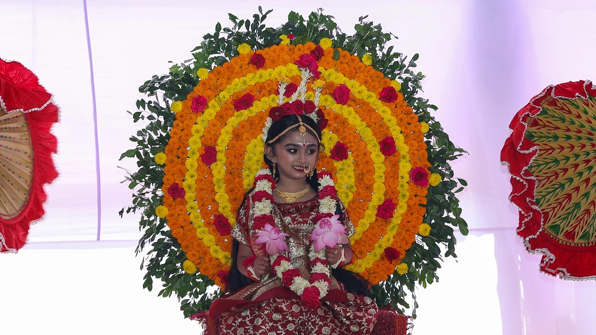 মহাষ্টমীতে কুমারী পূজার আসনে দেবীরূপে উপবিষ্ট কুমারী
