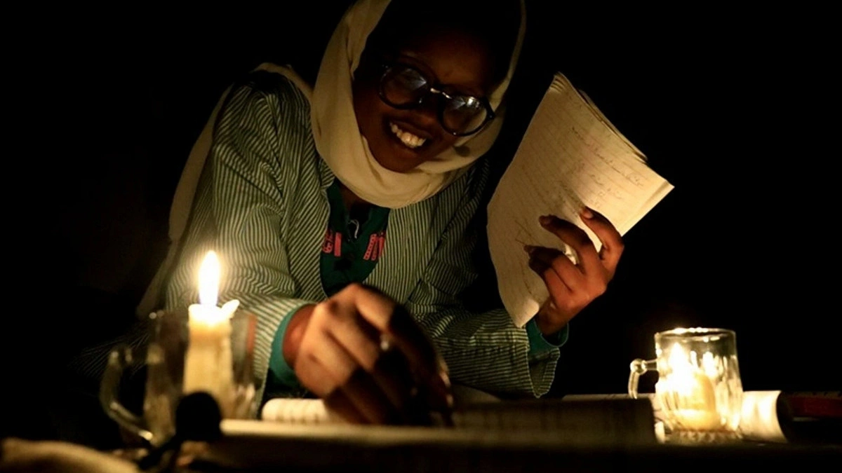 Sudan Students Prepare Homeworks In Candlelight