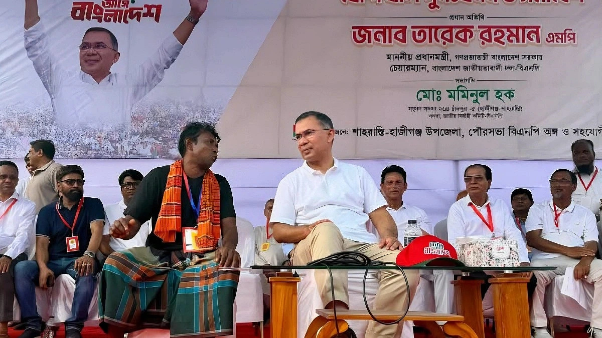 Prime Minister Listens to a Farmer Sitting by His Side